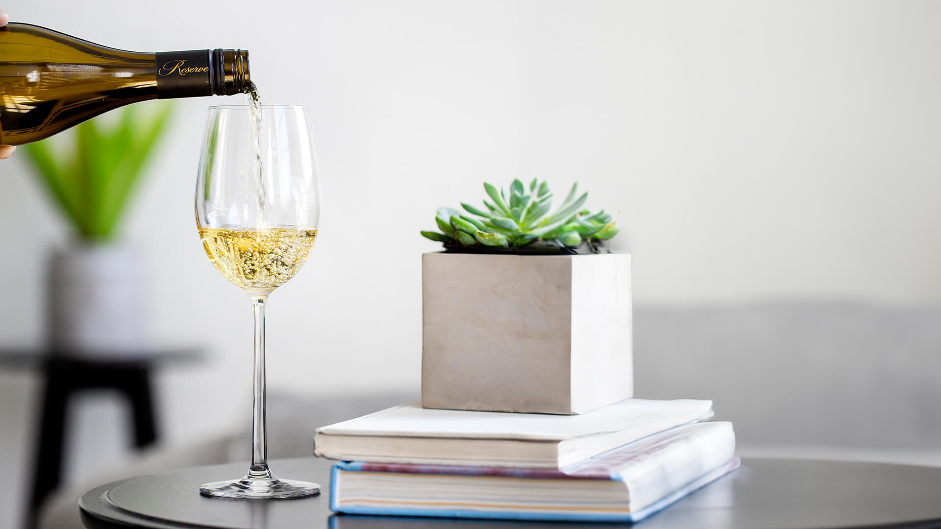 A glass of Chardonnay being served.